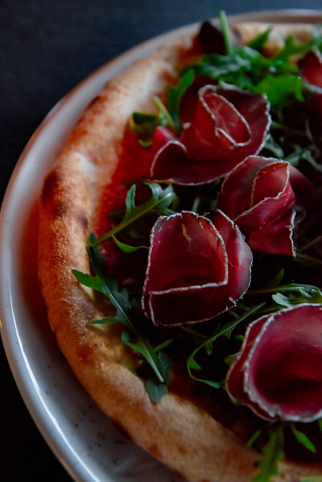 italian pizza with bresaola at restaurant Carpe Diem in Livigno